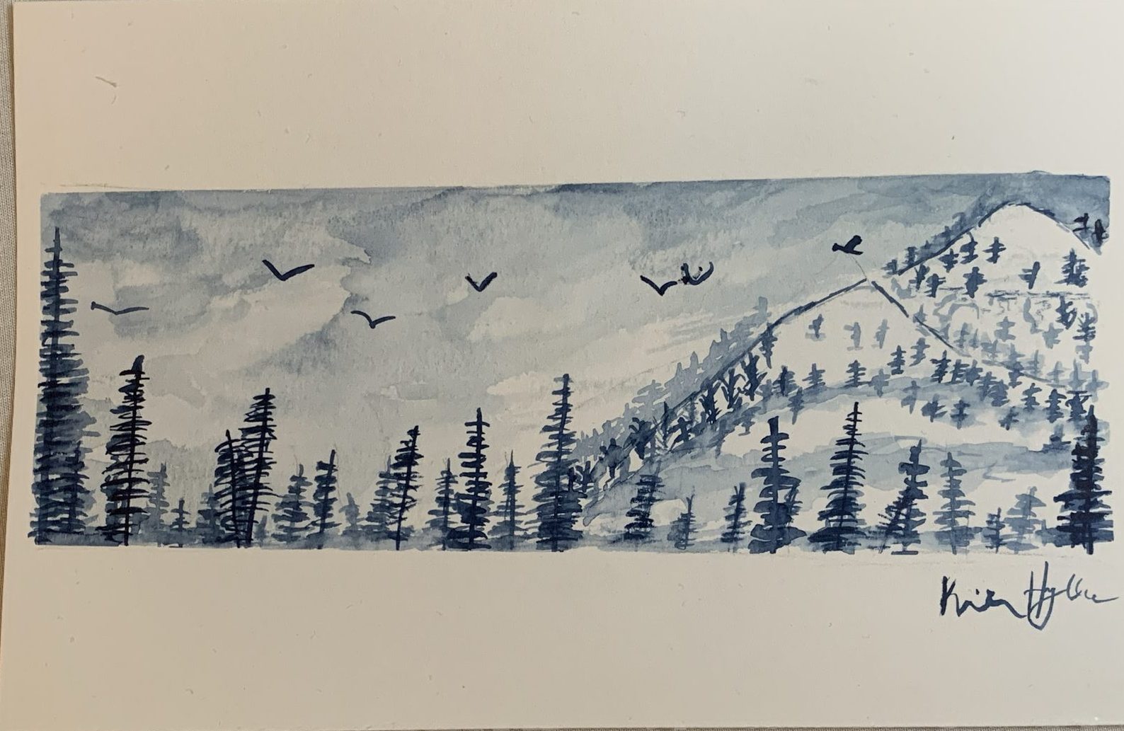 Blue watercolor of pine trees and a flock of birds over a mountain slope, signed in the corner