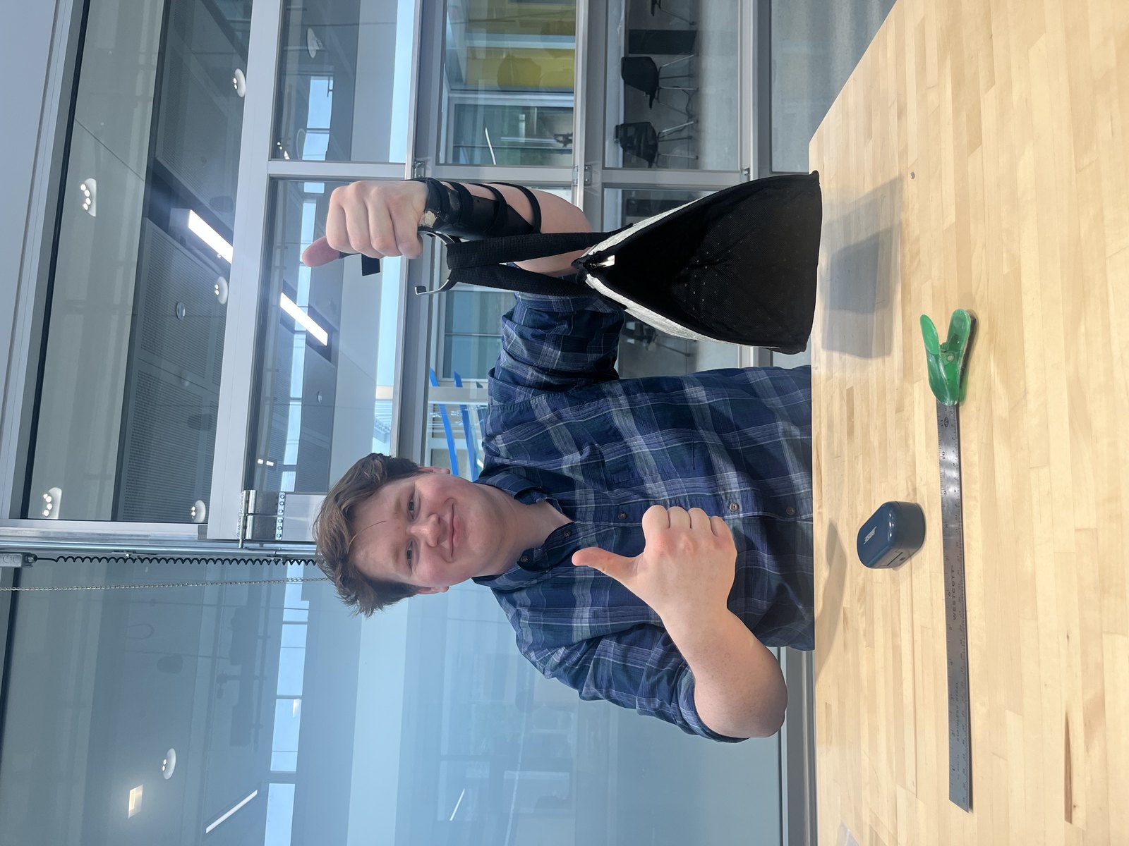 Using the J-hook attachment to lift an object