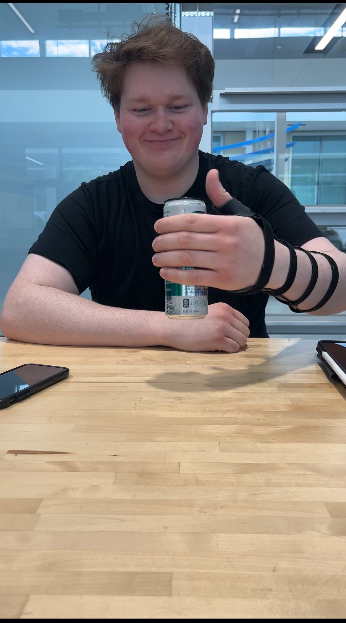 Holding a drink can against the platform attachment without using the thumb